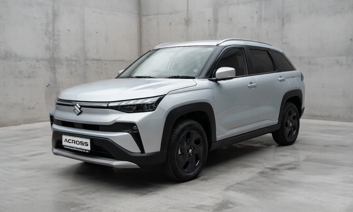 Silver Suzuki Across in a concrete studio